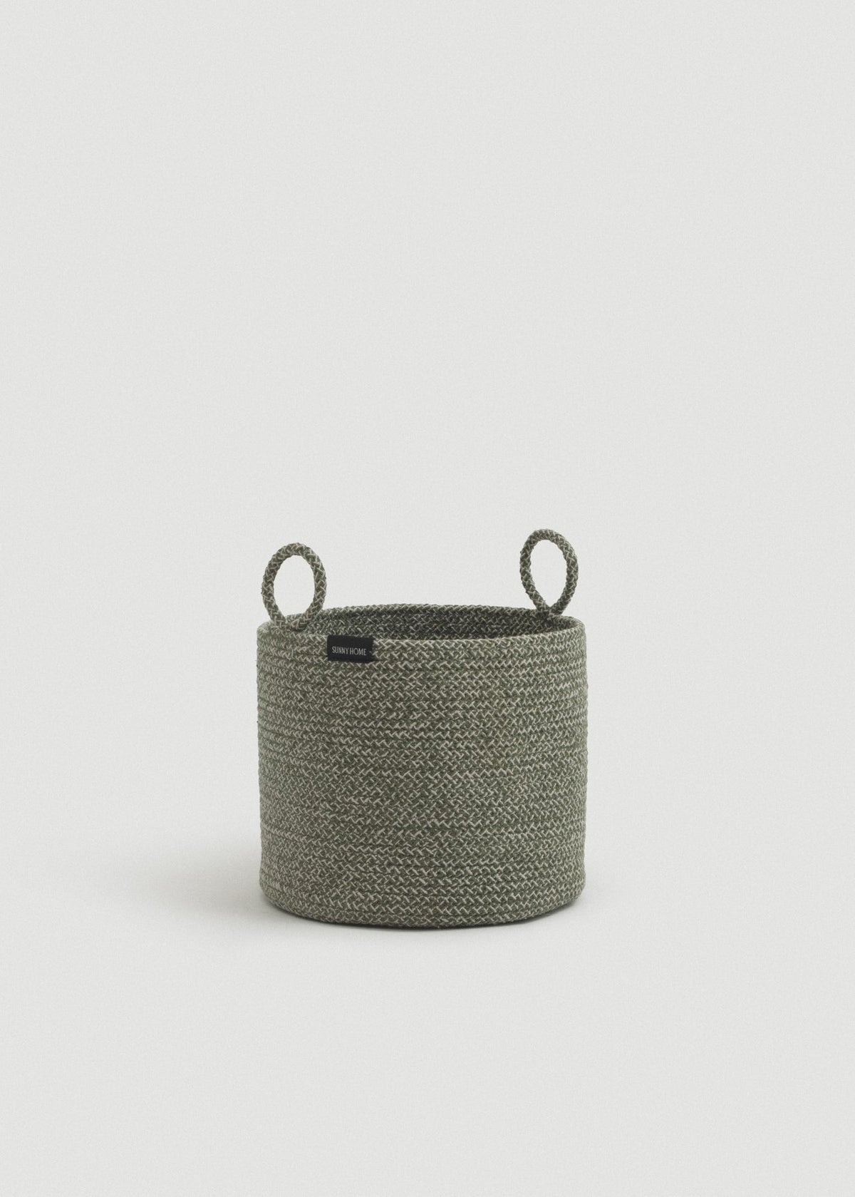 Green melange cotton rope storage basket with a cylindrical shape and two upright loop handles.
