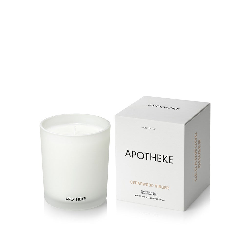 Cedarwood Ginger Classic Candle in white glass vessel beside APOTHEKE packaging box