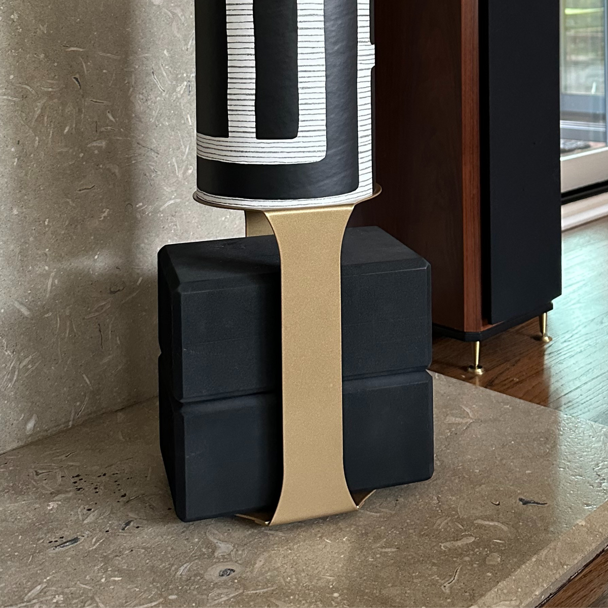 Close-up of the Colony tube on four black blocks secured with a wide tan support strap.