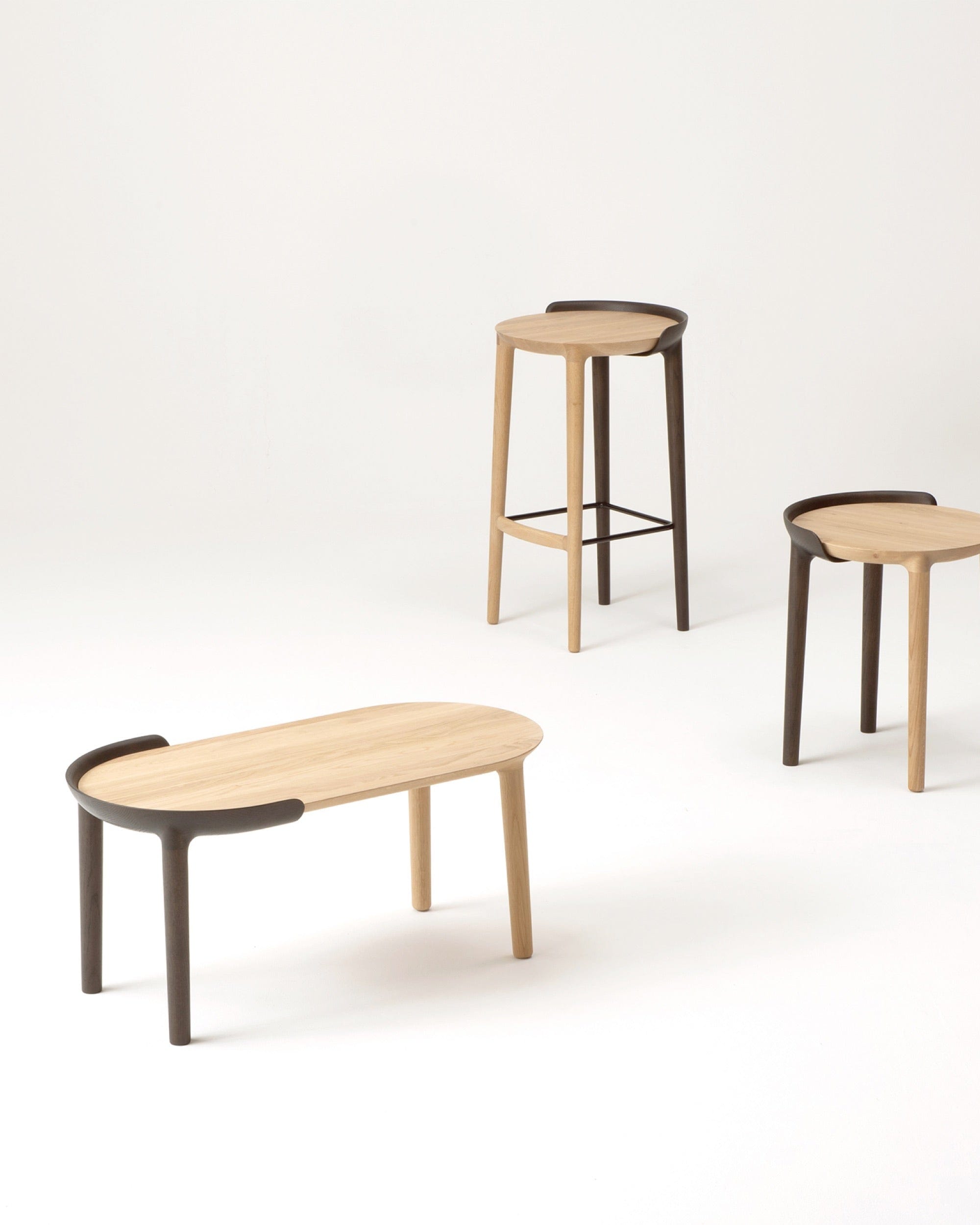 CRUST Coffee Table with CRUST Stools shown in Dark Gray Wash
