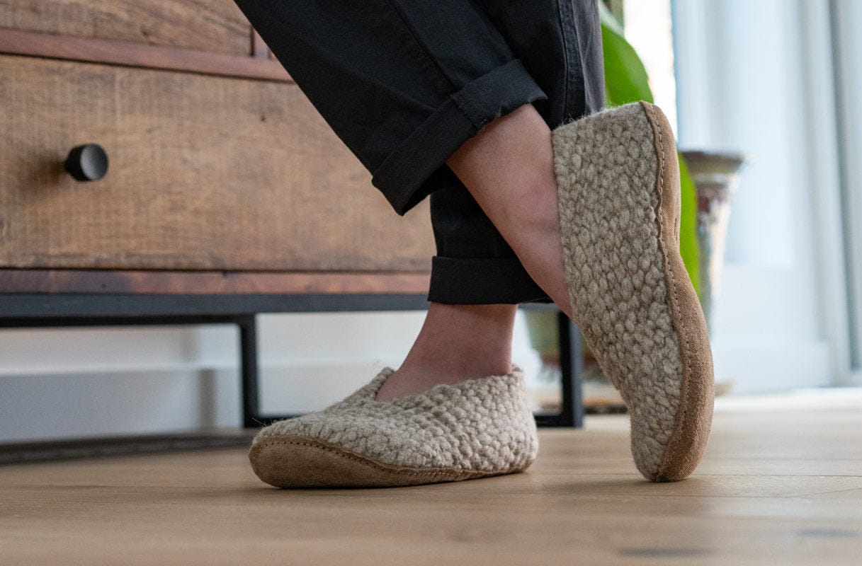 Load video: The Making of Kyrgies Wovens, The Woven wool is crafted into slippers in Bishkek, Kyrgyzstan.