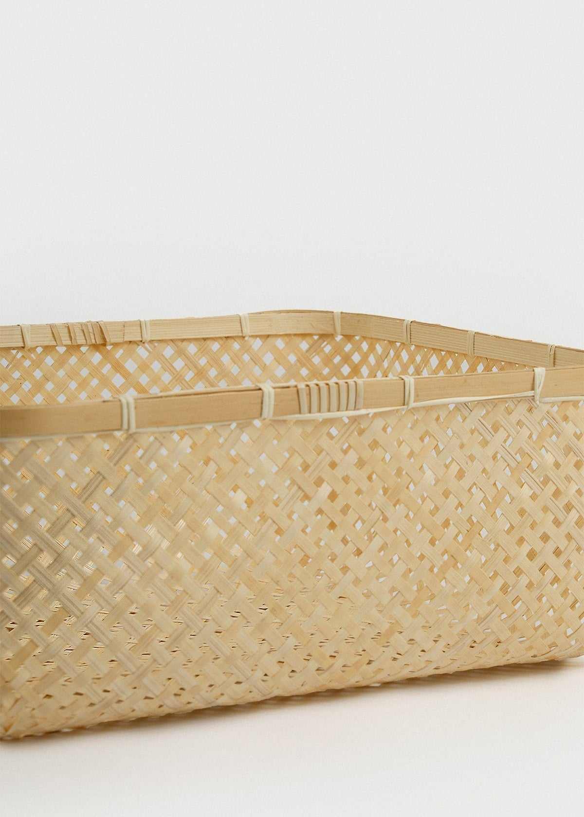 Close-up of the open diamond weave, reinforced upper rim, and natural bamboo texture.