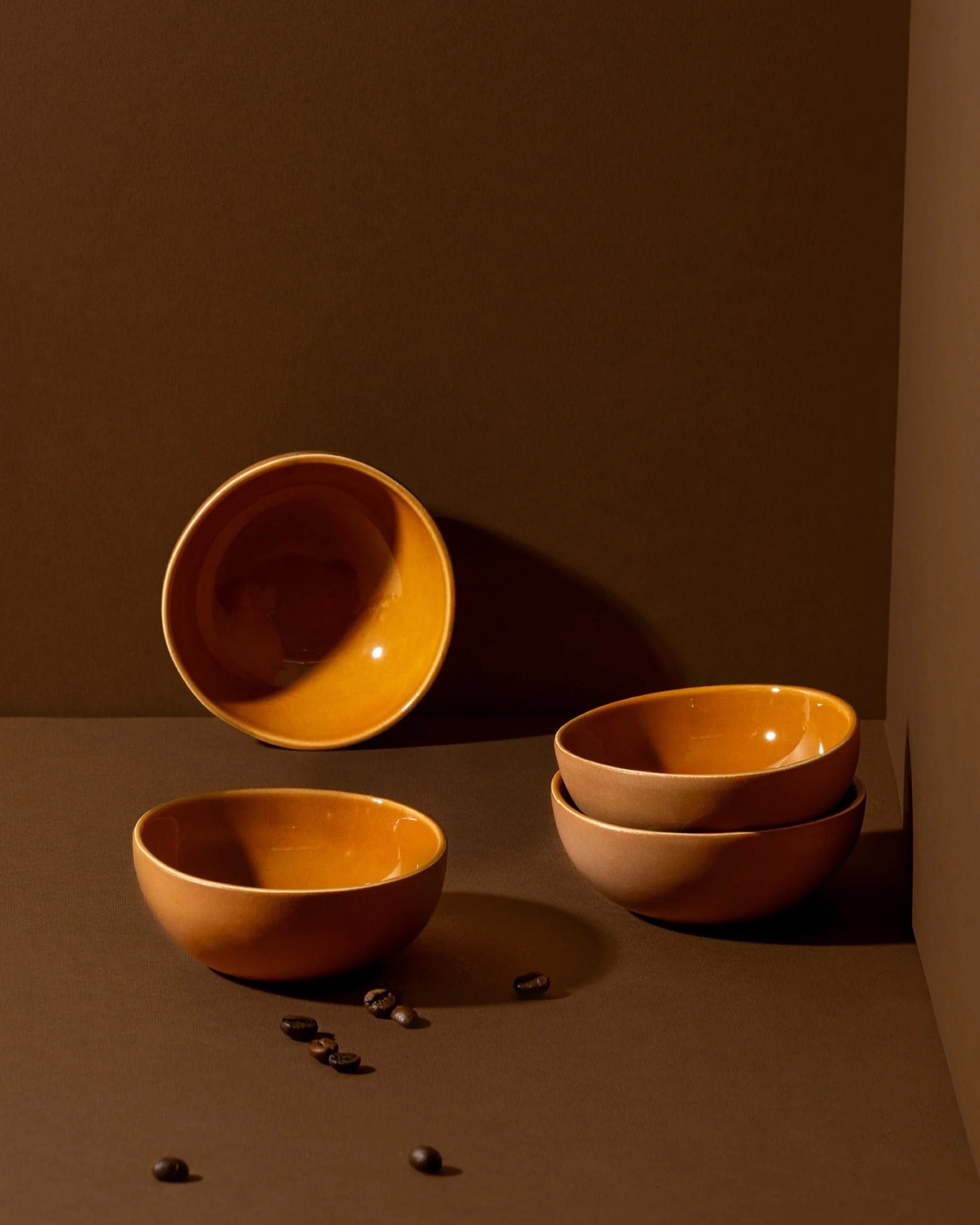 Stoneware bowls in Terracotta styled together on warm-toned background