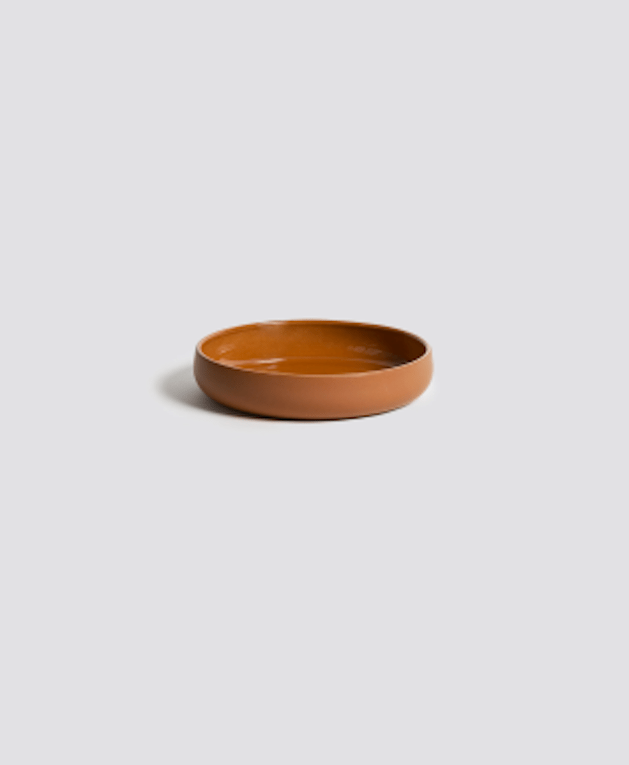 Stoneware bowl in Terracotta side profile view on neutral background