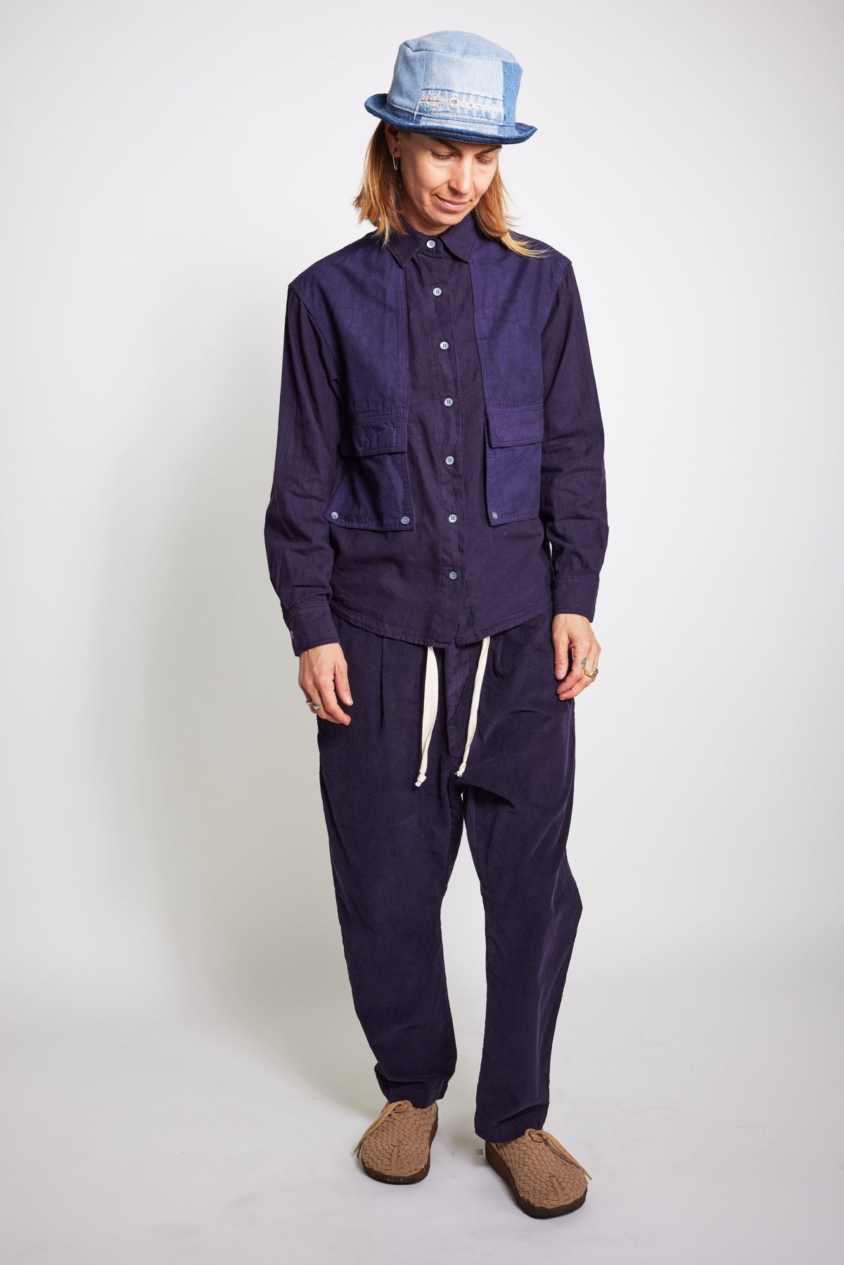 Full-length front view of the navy Trek Shirt with matching pants and a pale blue bucket hat.