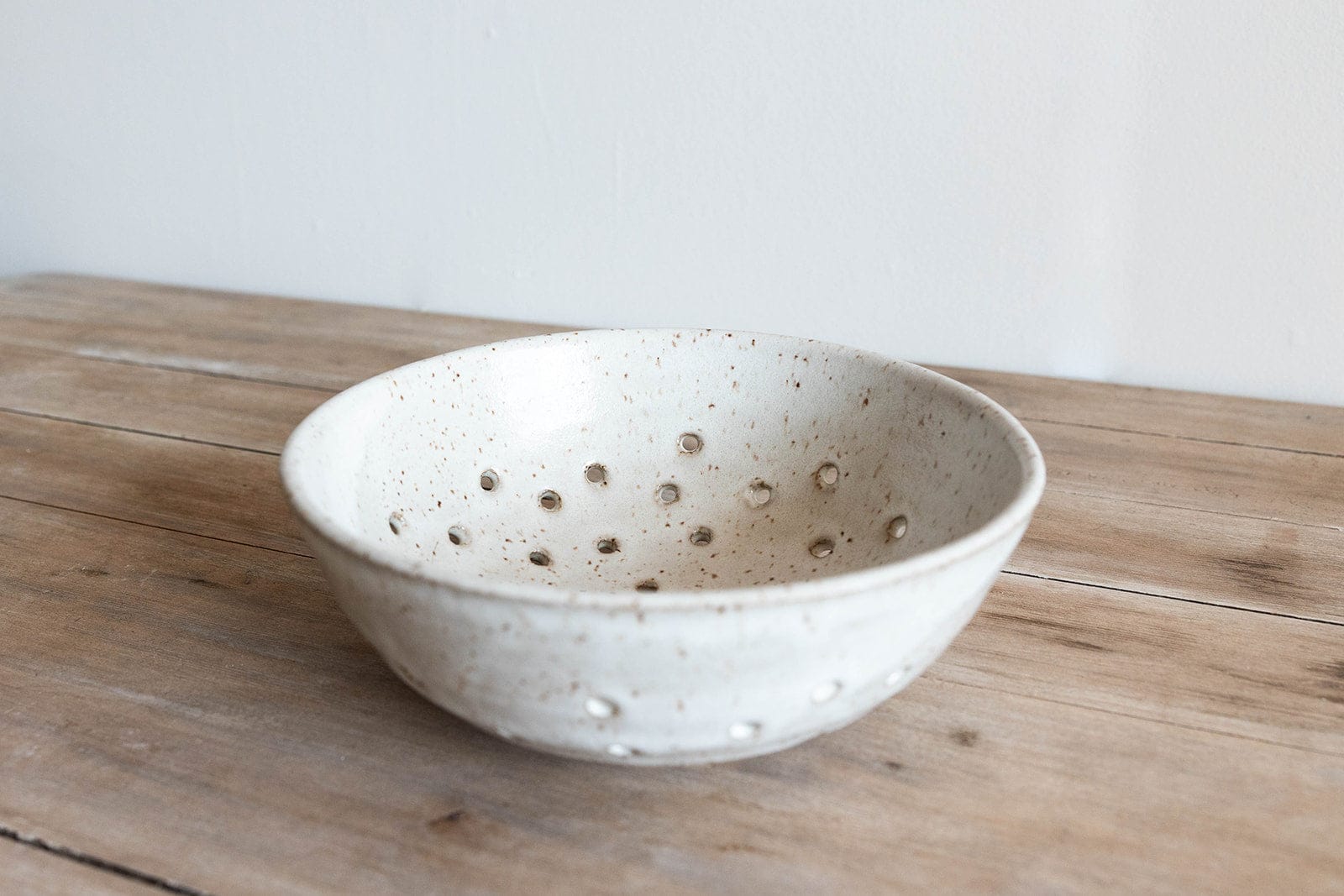 Handmade ceramic berry bowl colander in speckled glaze by KJ Pottery