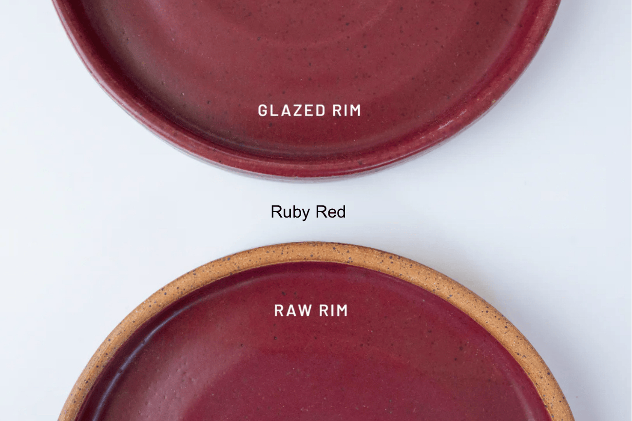 Two red ceramic plates with 'Glazed Rim' and 'Raw Rim' labels on a white background by KJ Pottery