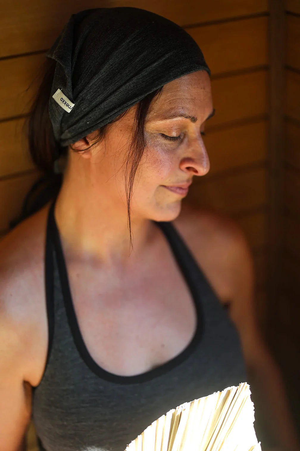 Merino wool sauna bandana providing breathable comfort and natural temperature regulation in a sauna setting.