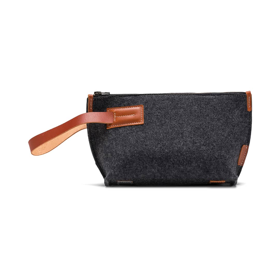 Charcoal wool felt travel pouch with leather accents and zippered closure