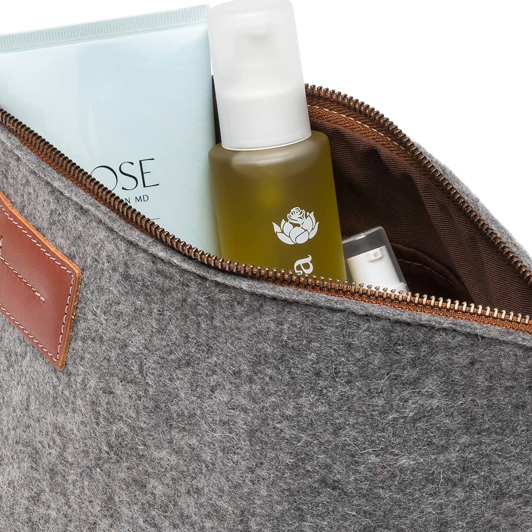 Inside Kyrgies felt travel kit showing spacious storage for toiletries and travel essentials