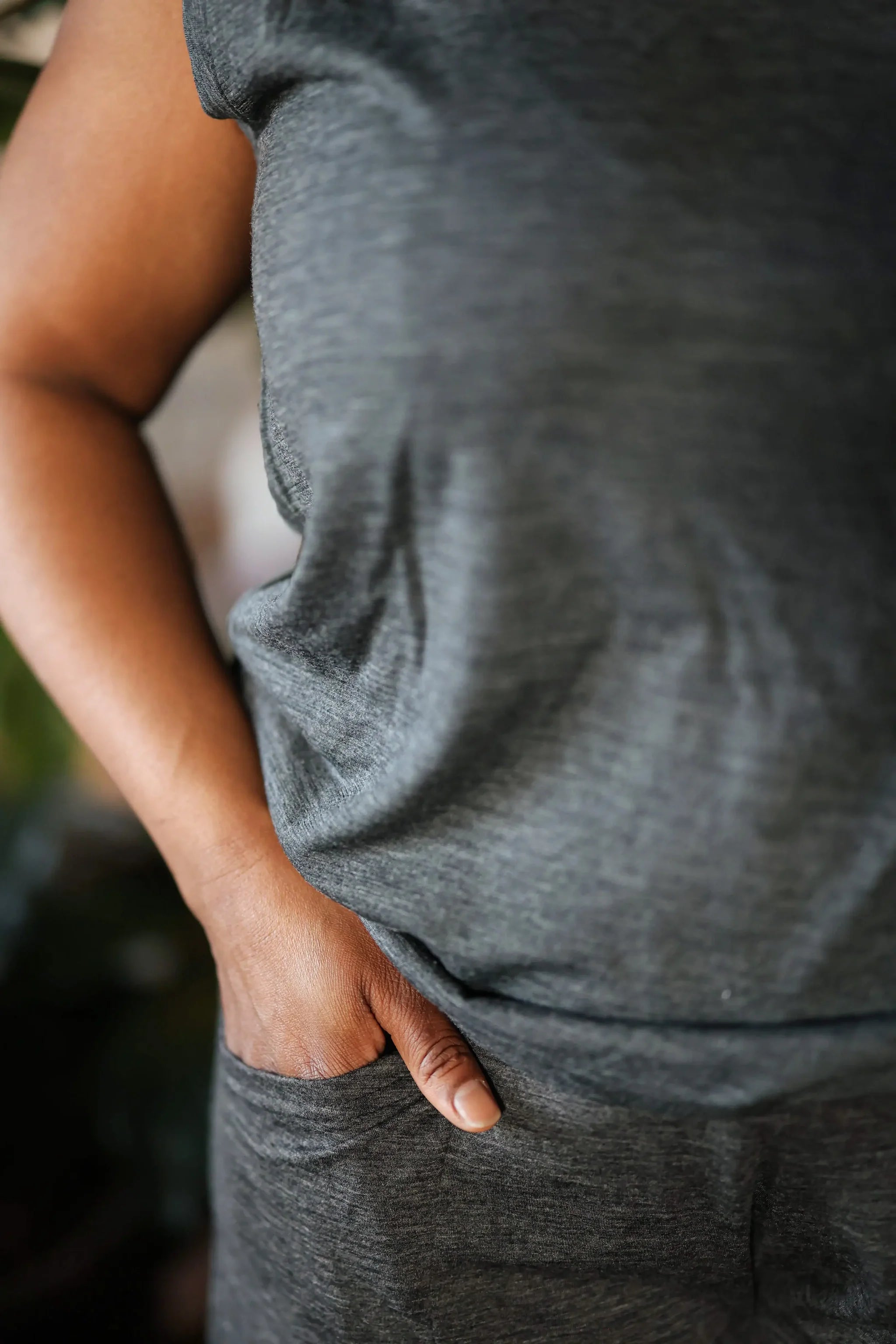 Close-up detail of a merino wool sauna tee showing soft texture, breathable natural fibers, and relaxed fit.