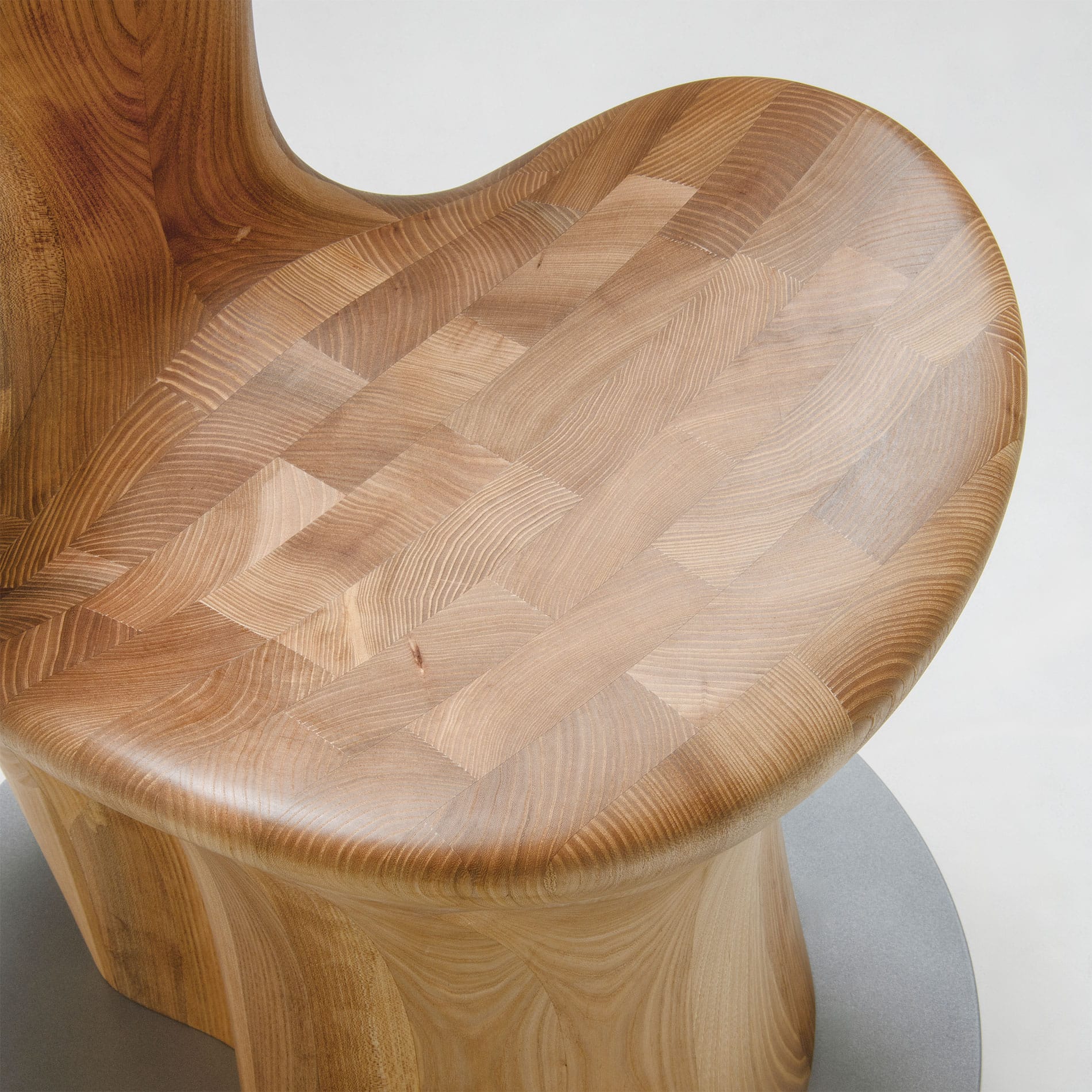 Close-up of Japanese Elm seat detail on HUG Chair by CondeHouse