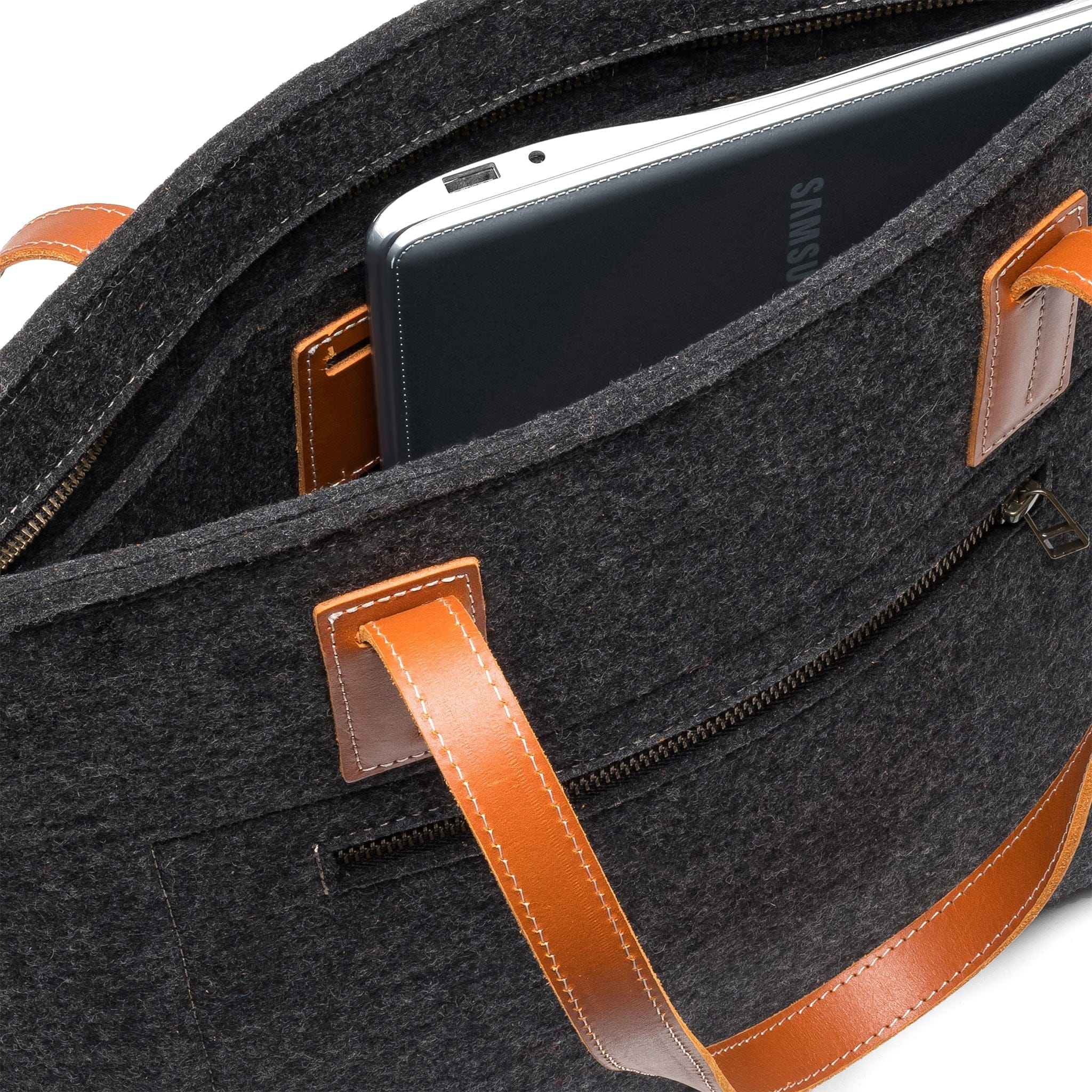 Inside Kyrgies wool tote featuring zippered closure and interior storage pocket