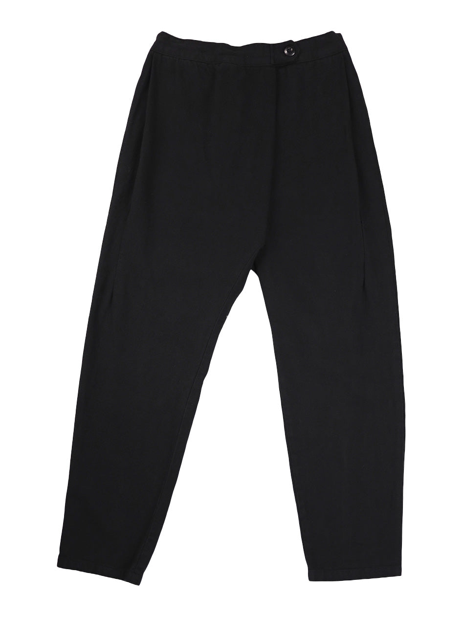 Front product view of black Canvas Souk pants with a buttoned waistband and tapered legs.