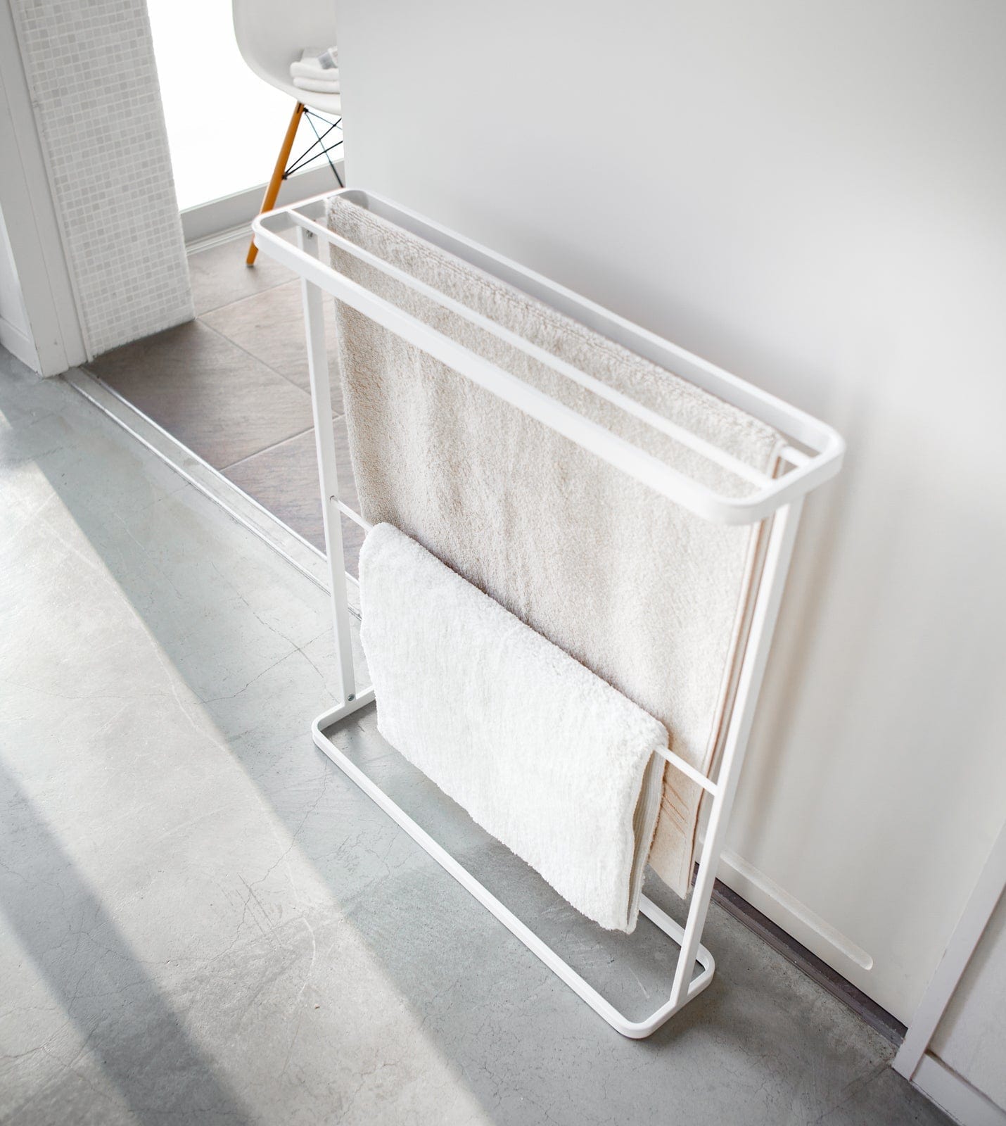 White towel rack with towels in a bathroom setting. Bath Towel Hanger (30" H) - Steel