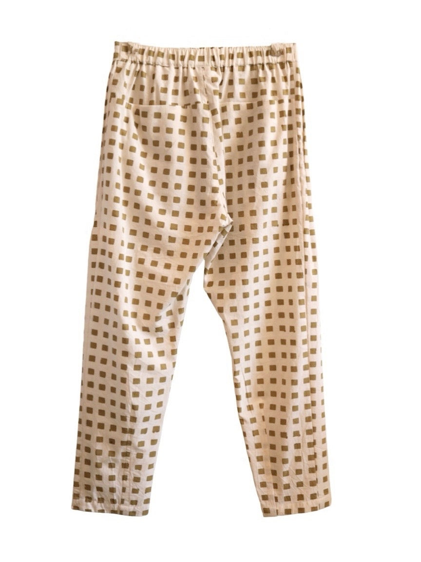 Back product view of cream Souk pants with ochre squares and an elastic waistband.