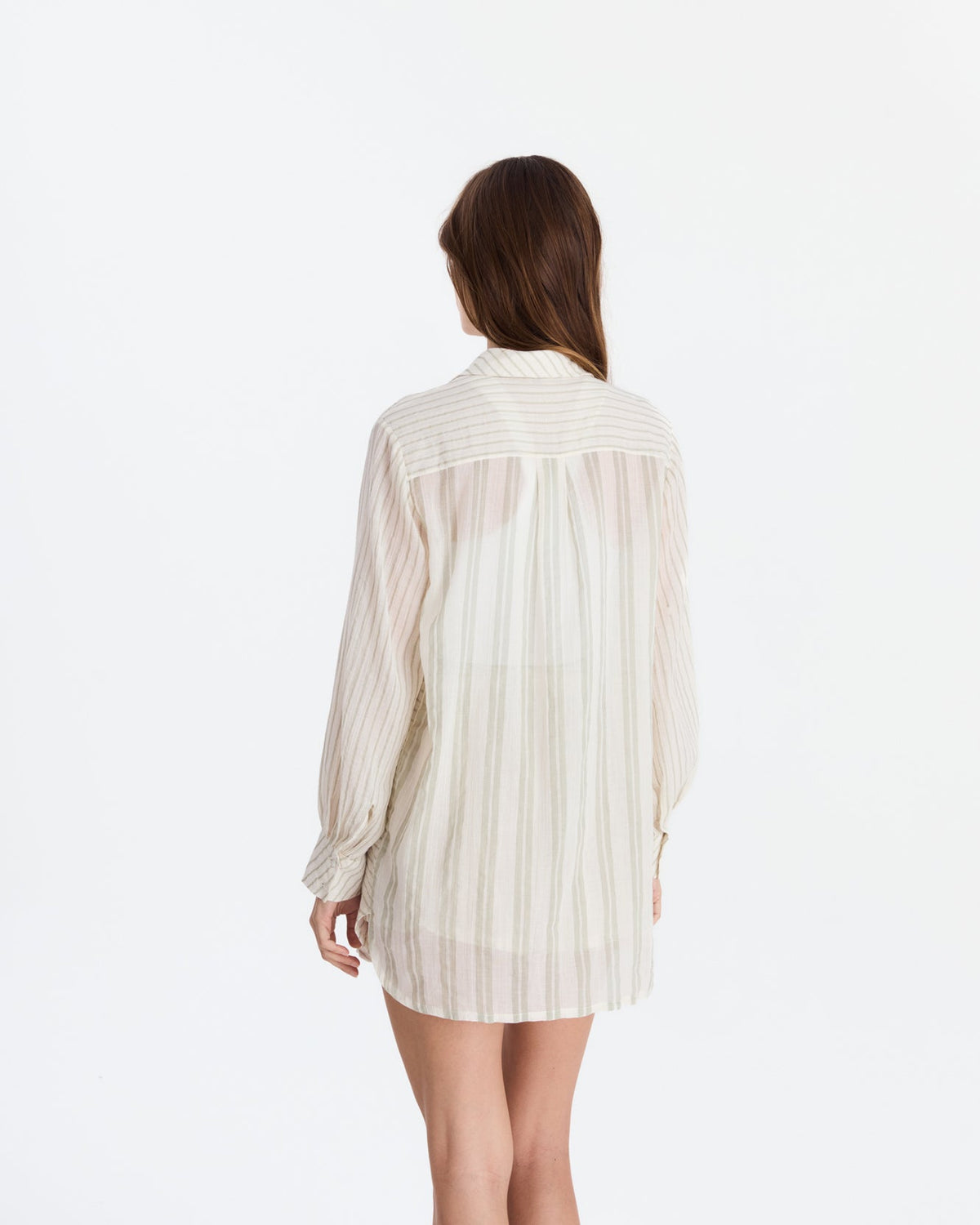 Back view showing a horizontal striped shoulder panel above a gathered, vertically striped back and long sleeves.