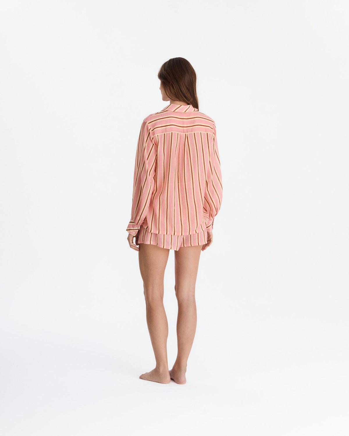 Back view showing the shirt’s horizontal striped shoulder panel, vertically striped back, and matching shorts.