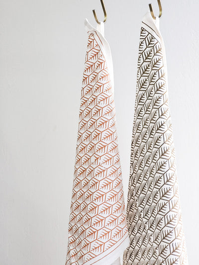 Korissa Hand Screen Printed Tea Towels, light and dark brown print, hanging vertically