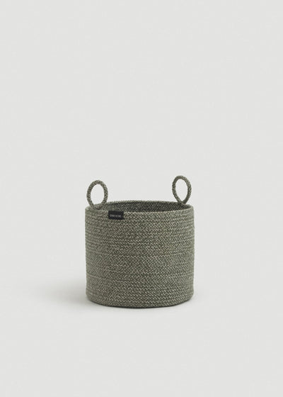 Green melange cotton rope storage basket with a cylindrical shape and two upright loop handles.