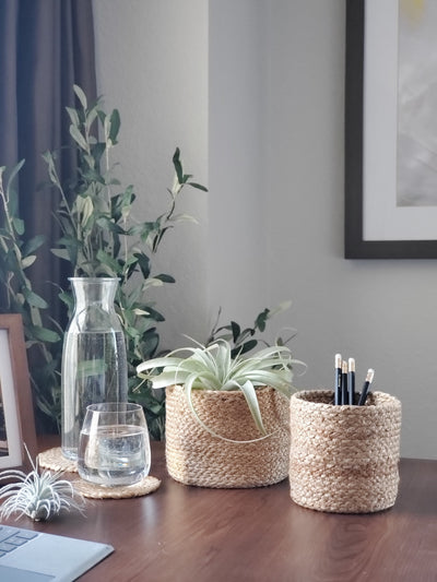 Korissa Kata Bin on wood table with glass carafe