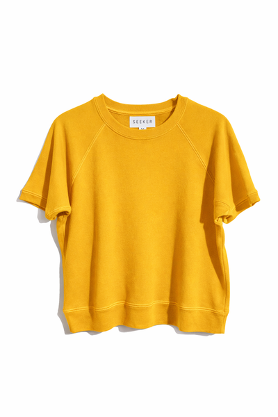 Front product view of the golden yellow short-sleeve raglan shirt.
