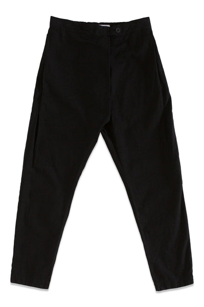Front product view of black Souk pants with a buttoned waistband and tapered legs.