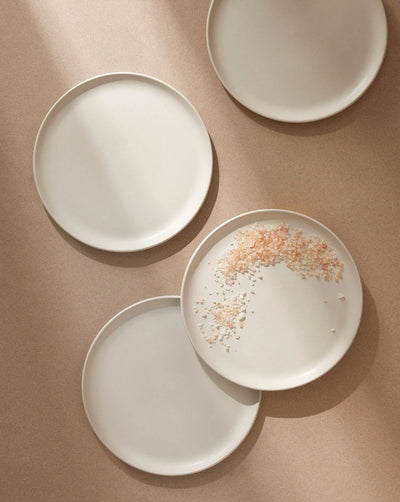 Stoneware dinner plates in Matte White overhead view with sea salt flakes