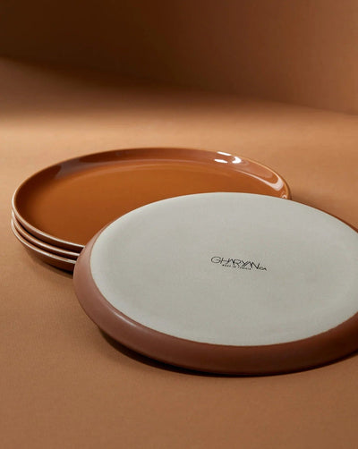 Stoneware side plates in Terracotta stacked showing glazed interior