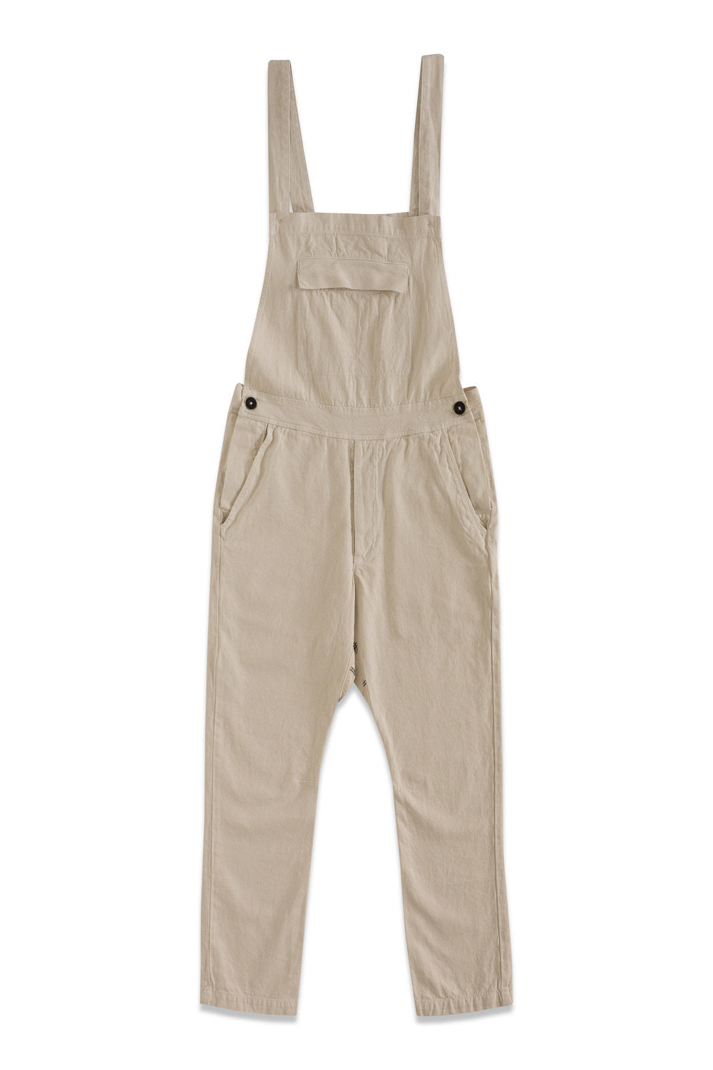 Front product view of cream overalls with adjustable straps, a bib pocket, and tapered legs.