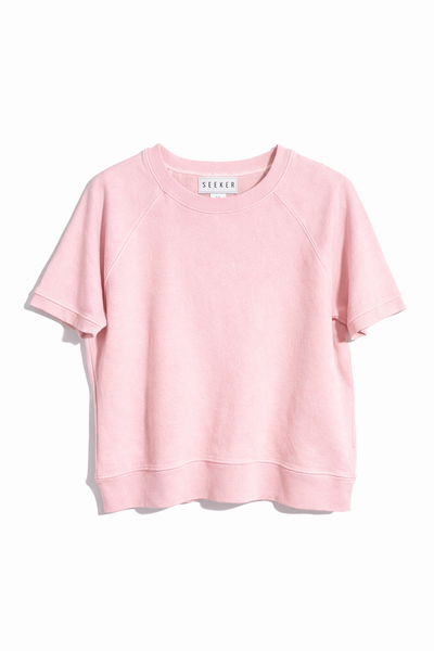Front product view of the pale pink short-sleeve raglan shirt.
