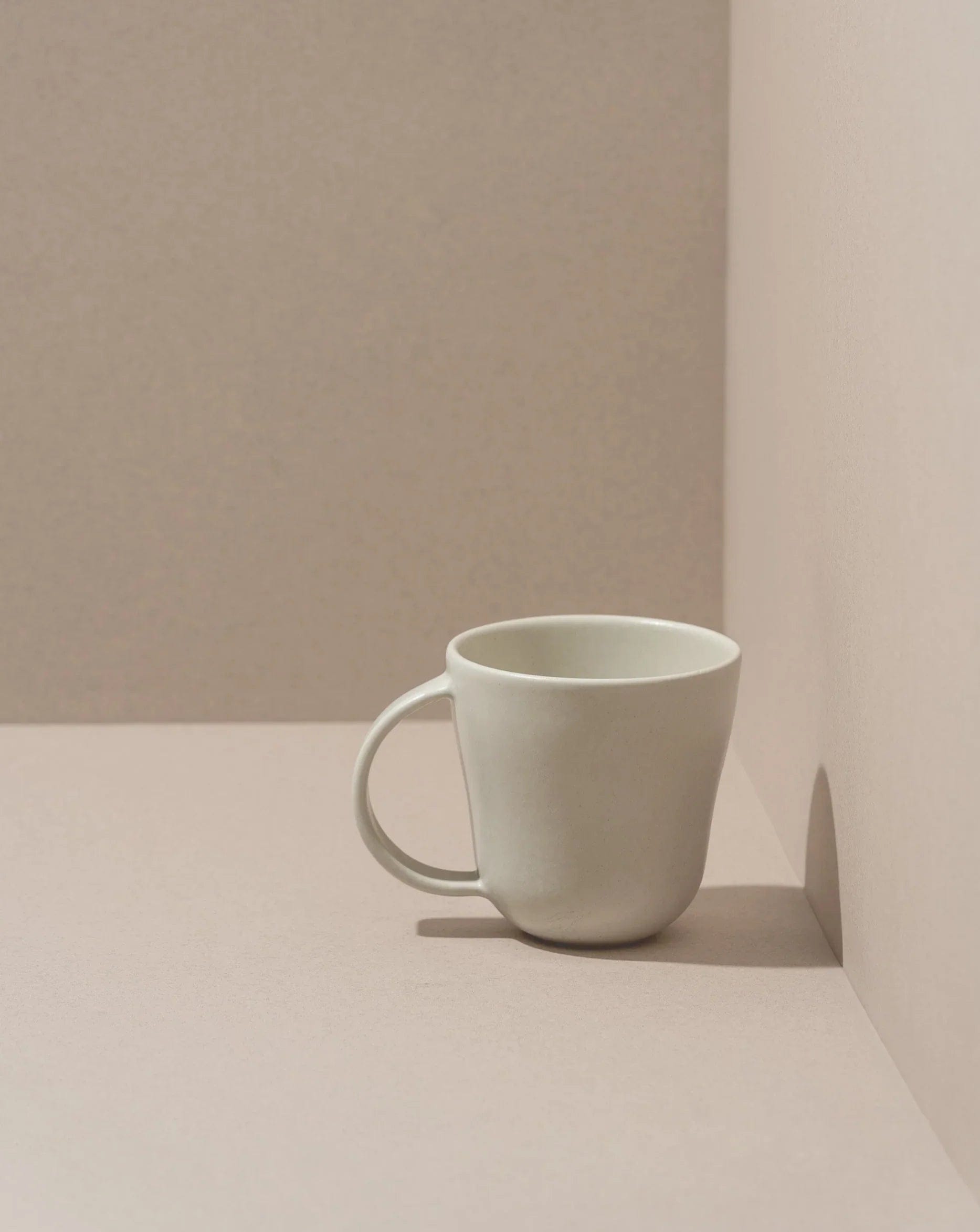 Stoneware mug in Matte White on neutral background
