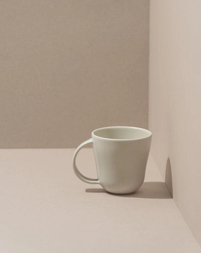 Stoneware mug in Matte White on neutral background