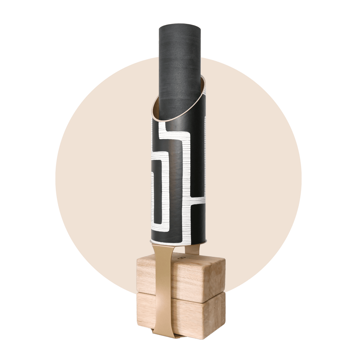 Colony tube and rolled black mat displayed on the wooden base with a contrasting tan support strap.