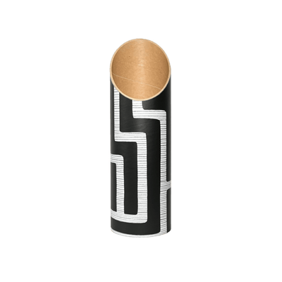 Front view of the empty black-and-white maze-patterned tube, showing its angled opening and warm kraft-paper interior.