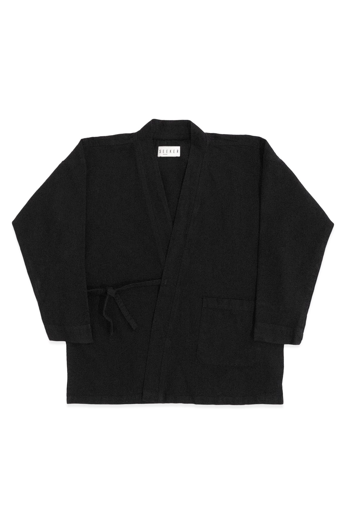 Front product view of the black GI wrap jacket with waist ties and patch pockets.