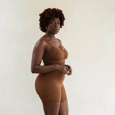 Side profile of seamless nude shapewear bodysuit with breathable stretch and smoothing support