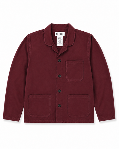 Front product view of the burgundy Travelers Jacket with three patch pockets.