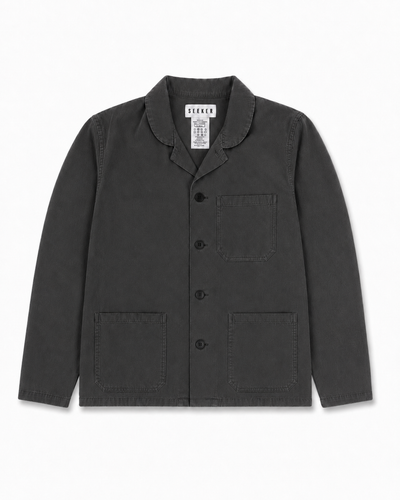 Front product view of the charcoal-gray Travelers Jacket with three patch pockets.