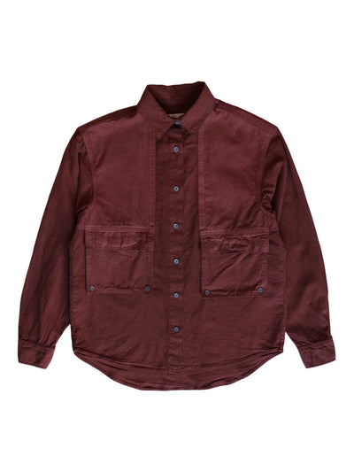 Front product view of the rust-red Trek Shirt with four utility pockets.