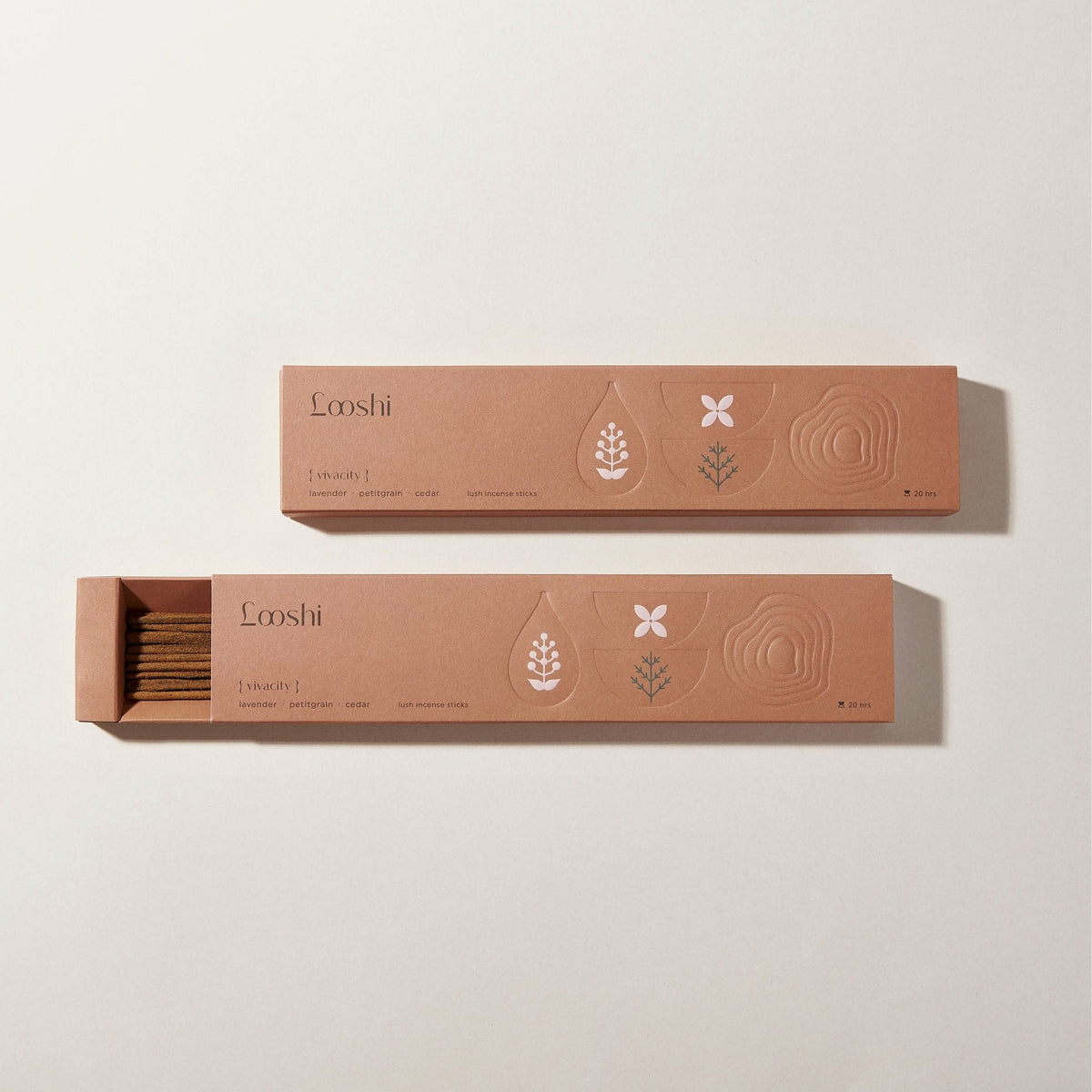 Open and closed warm brown boxes of Looshi Vivacity incense sticks displayed on a cream background
