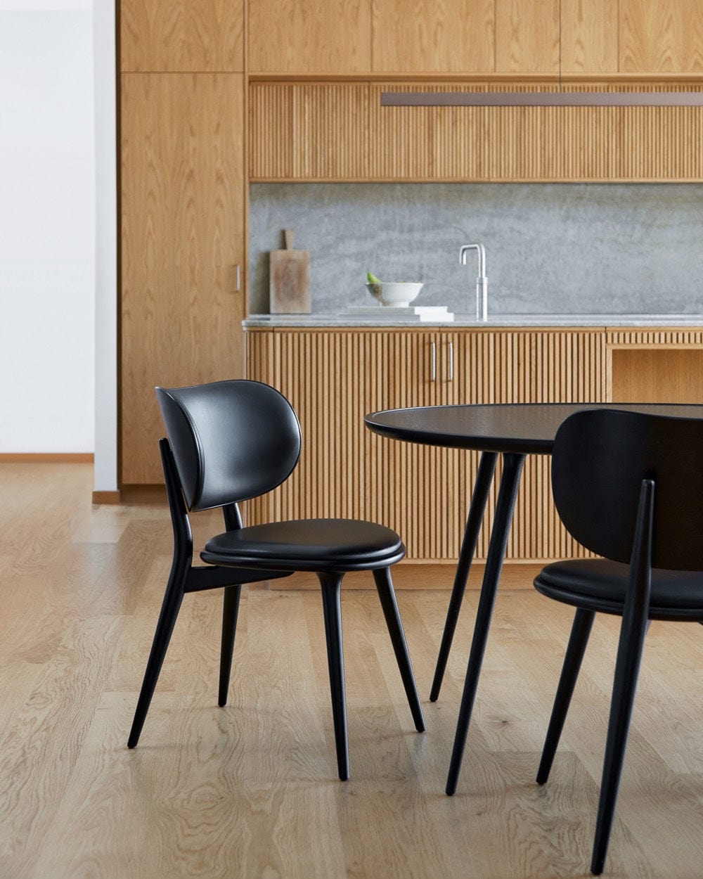 Mater The Dining Chair paired with Accent Dining Table in Scandinavian dining room