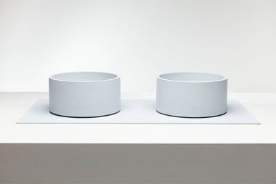 Two matching Mogo Bowls displayed side by side on a raised white platform.