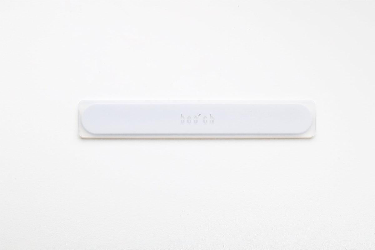 Slim white Mogo Spatula laid horizontally, with a low-profile rounded rectangular shape and subtle Boo Oh logo centered on the handle.