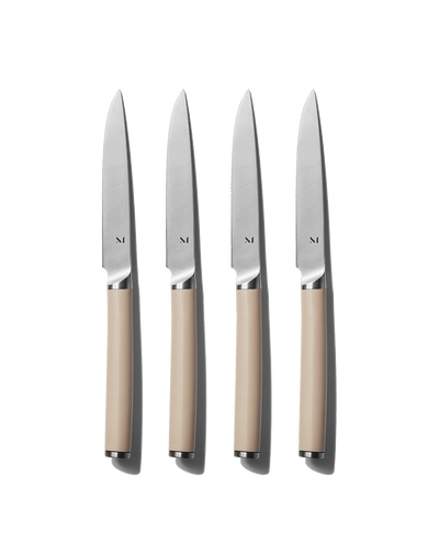The Table Knives set of four with matte handles, Morel color standing upright on white background