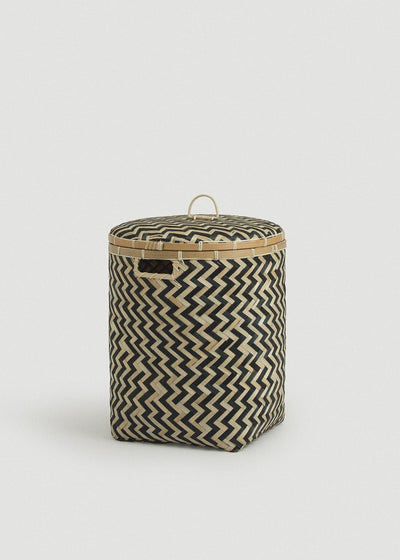 Medium cylindrical bamboo basket displaying the bold black chevron pattern.