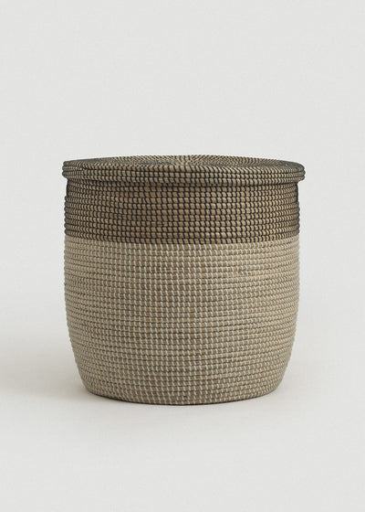 Front view of the Large Black Medina basket showing its tall rounded shape and dark woven rim.