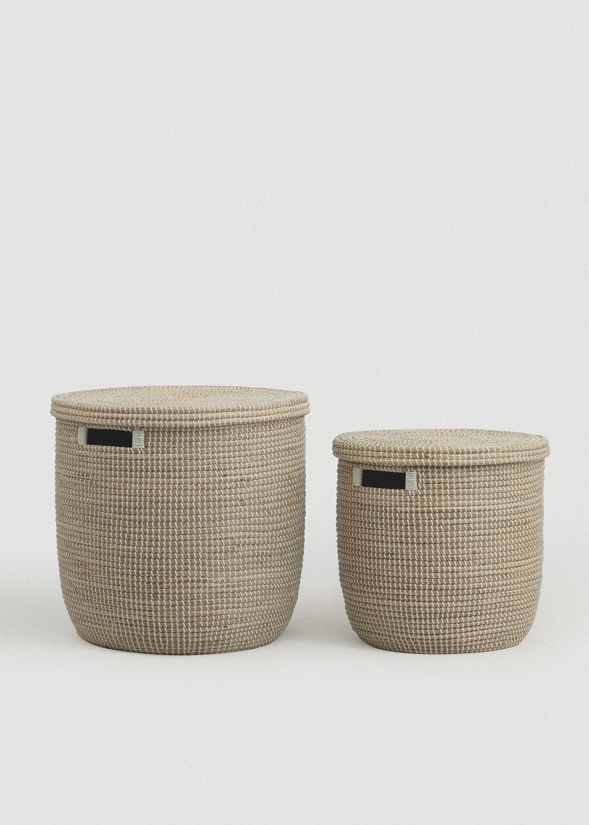 Large and small Medina seagrass baskets displayed together for size comparison.
