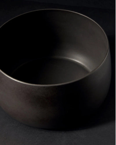 Stoneware serving bowl 120 oz in Matte Black angled view showing glazed interior
