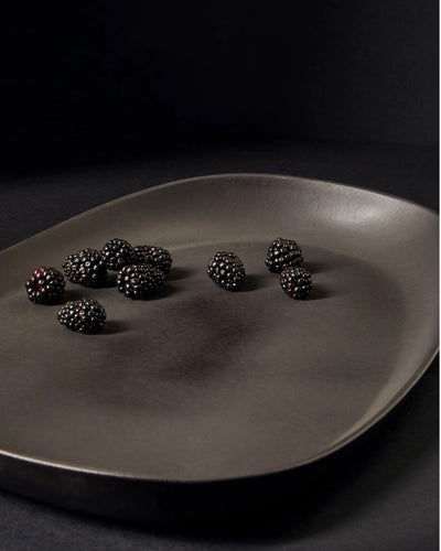 Stoneware long serving platter in Matte Black with fresh blackberries